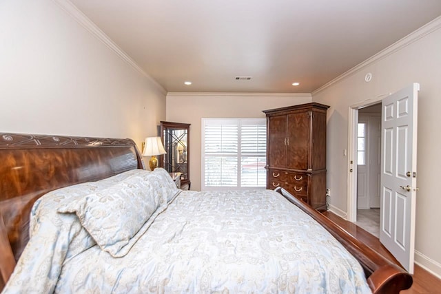 bedroom featuring wood-type flooring and crown molding