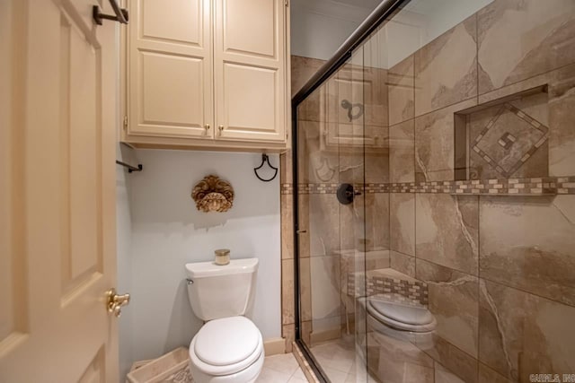 bathroom featuring toilet and walk in shower