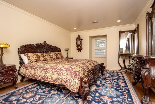 bedroom featuring wood-type flooring and ornamental molding