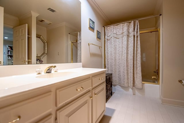 bathroom featuring ornamental molding, shower / bathtub combination with curtain, and vanity