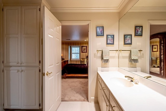 bathroom featuring ornamental molding and vanity