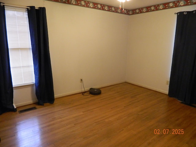 unfurnished room featuring wood-type flooring