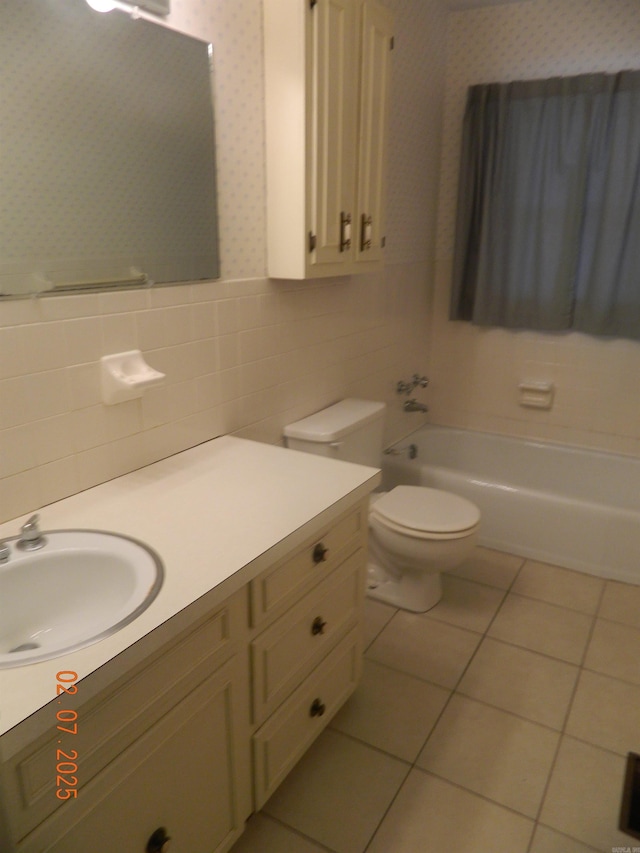 full bathroom featuring tile walls, vanity, tile patterned floors, shower / bathtub combination, and toilet