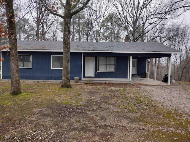 ranch-style house featuring a carport