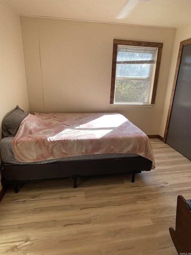 bedroom with light hardwood / wood-style floors