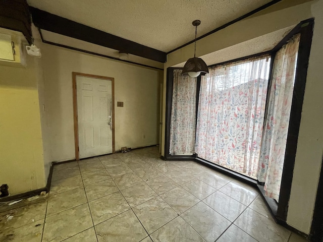 unfurnished dining area with light tile patterned floors and a textured ceiling