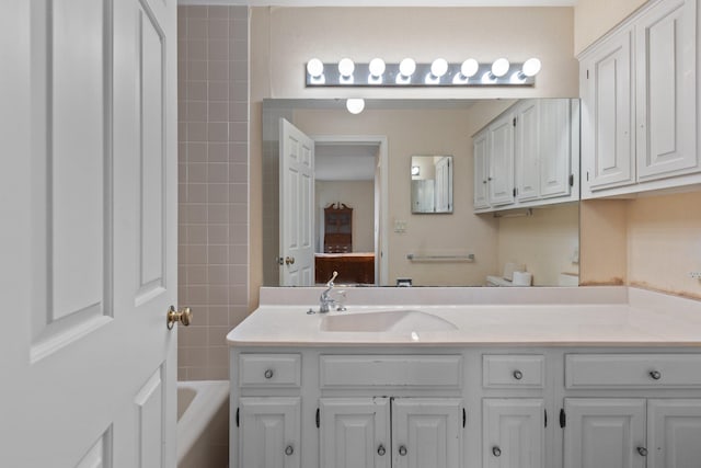 bathroom featuring vanity and a bath