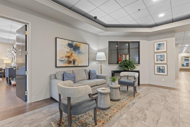 living room with a drop ceiling