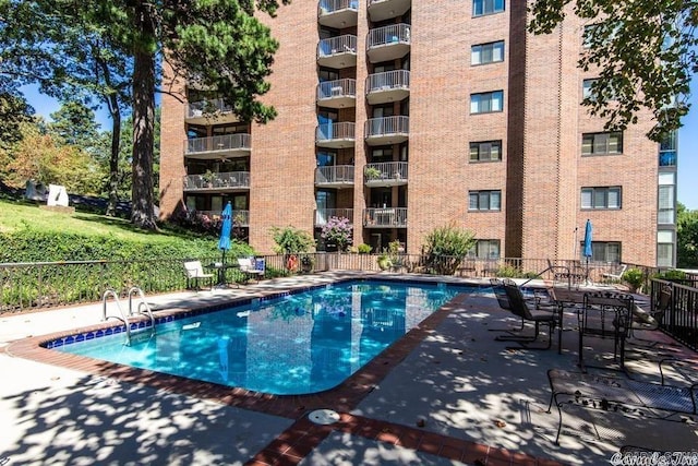 view of swimming pool featuring a patio area