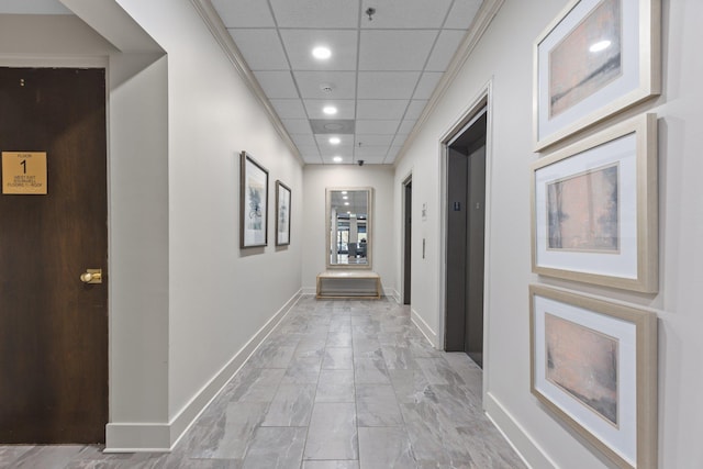 hallway with a drop ceiling