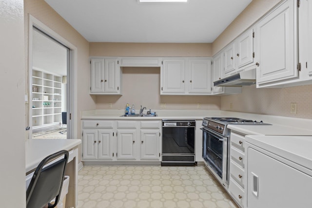 kitchen with white cabinetry, sink, stainless steel range, and black dishwasher