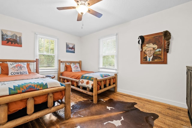 bedroom featuring hardwood / wood-style flooring and ceiling fan