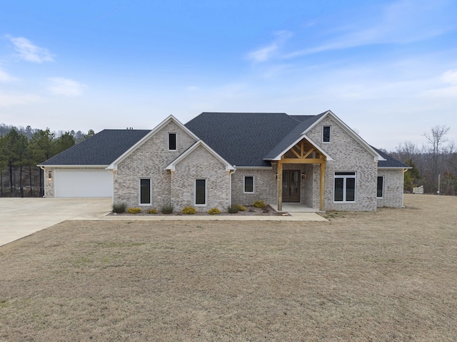 view of front facade with a garage and a front yard