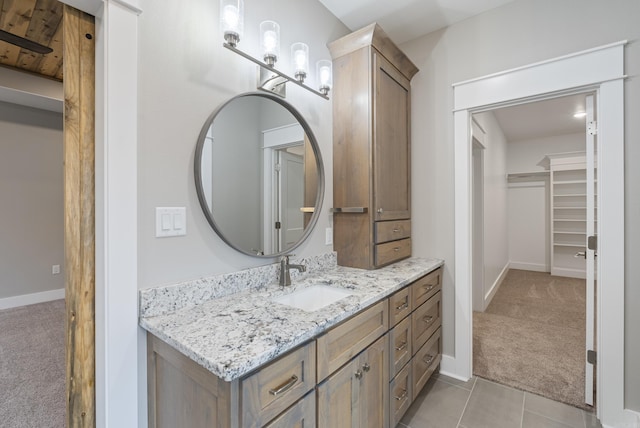 bathroom with tile patterned flooring and vanity