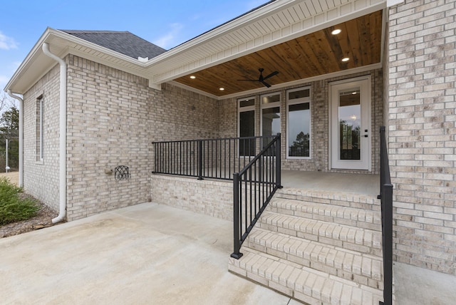 entrance to property featuring a patio area and ceiling fan