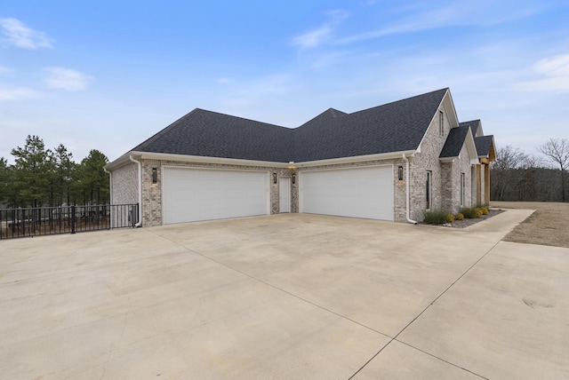 view of side of home featuring a garage