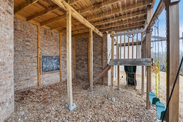 miscellaneous room featuring brick wall