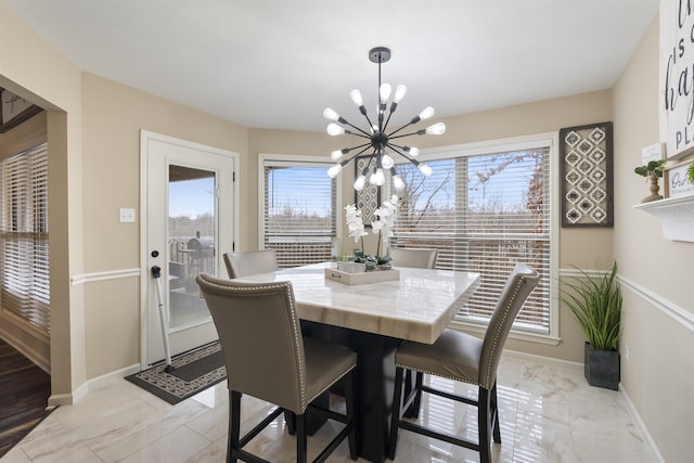 dining area featuring a chandelier