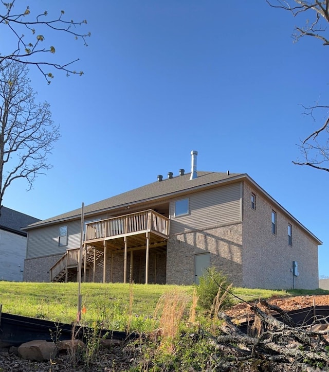 rear view of house with a wooden deck