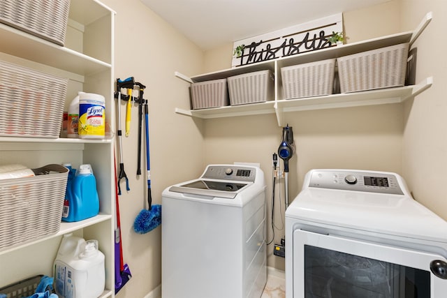 clothes washing area with washer and dryer