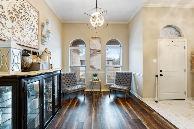 living area with ornamental molding, wood-type flooring, bar, and a chandelier