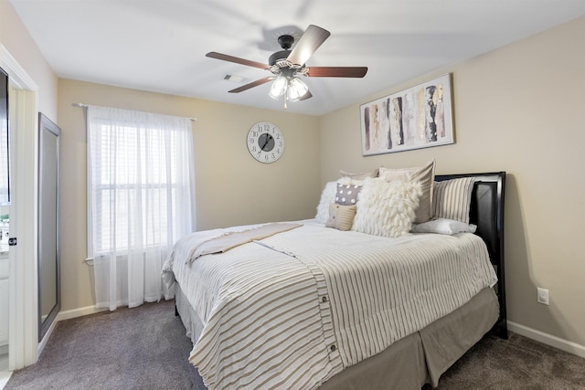 bedroom with ceiling fan and dark colored carpet