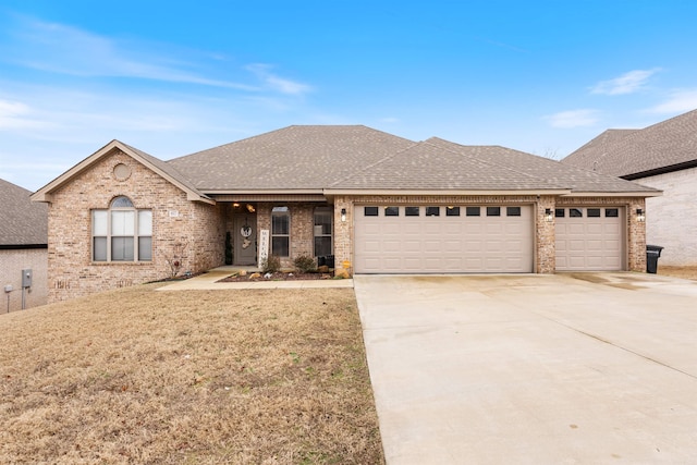 view of front facade with a garage and a front lawn