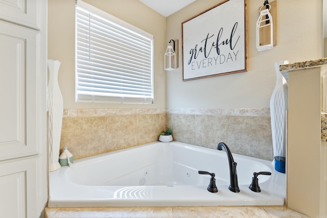 bathroom featuring a relaxing tiled tub