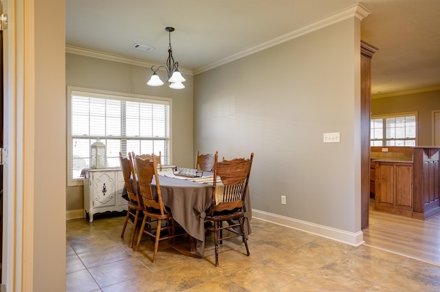 dining space with an inviting chandelier and crown molding