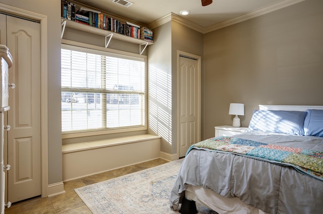 bedroom featuring light tile patterned floors and ornamental molding