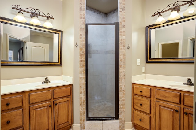 bathroom with vanity and a shower with shower door