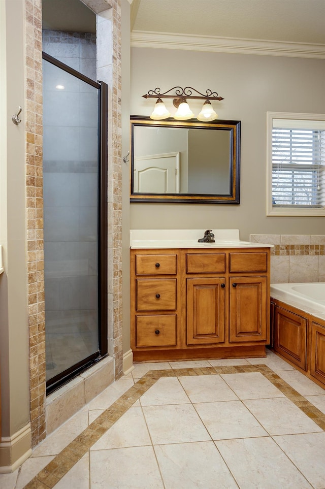 bathroom featuring tile patterned flooring, vanity, crown molding, and shower with separate bathtub