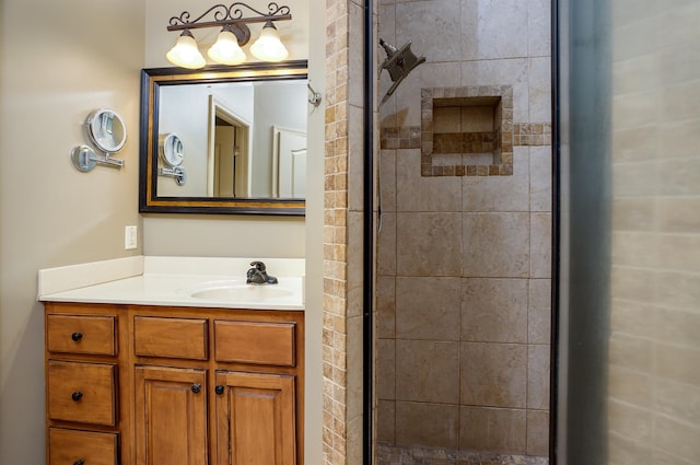 bathroom featuring vanity and a shower with door