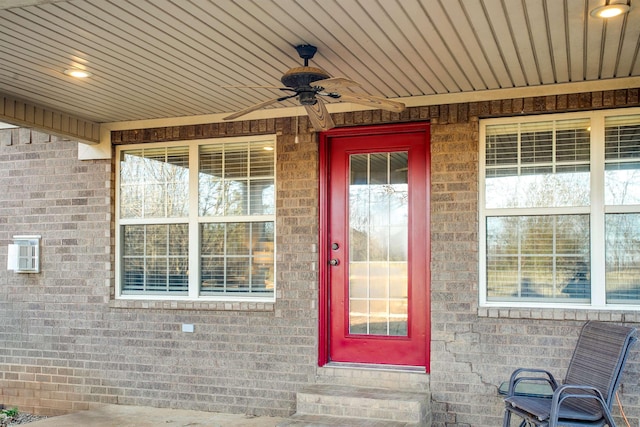 doorway to property featuring ceiling fan