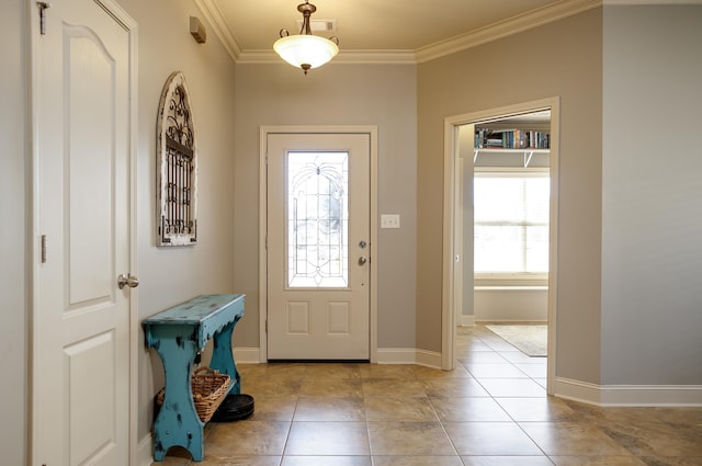 foyer with ornamental molding and light tile patterned flooring