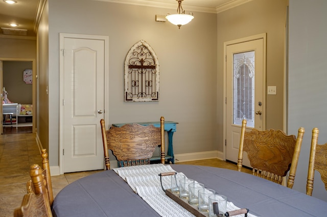 foyer featuring crown molding and light tile patterned flooring