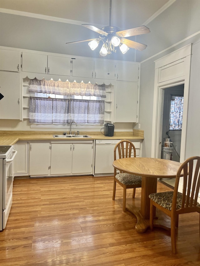 kitchen with sink, white cabinets, white appliances, and light wood-type flooring