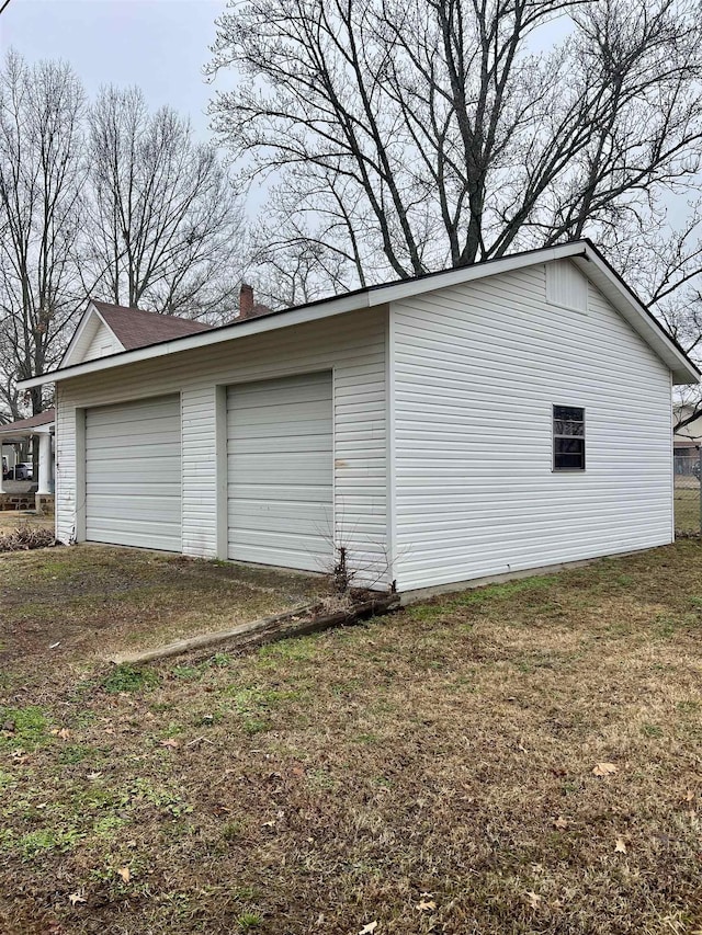 garage with a yard