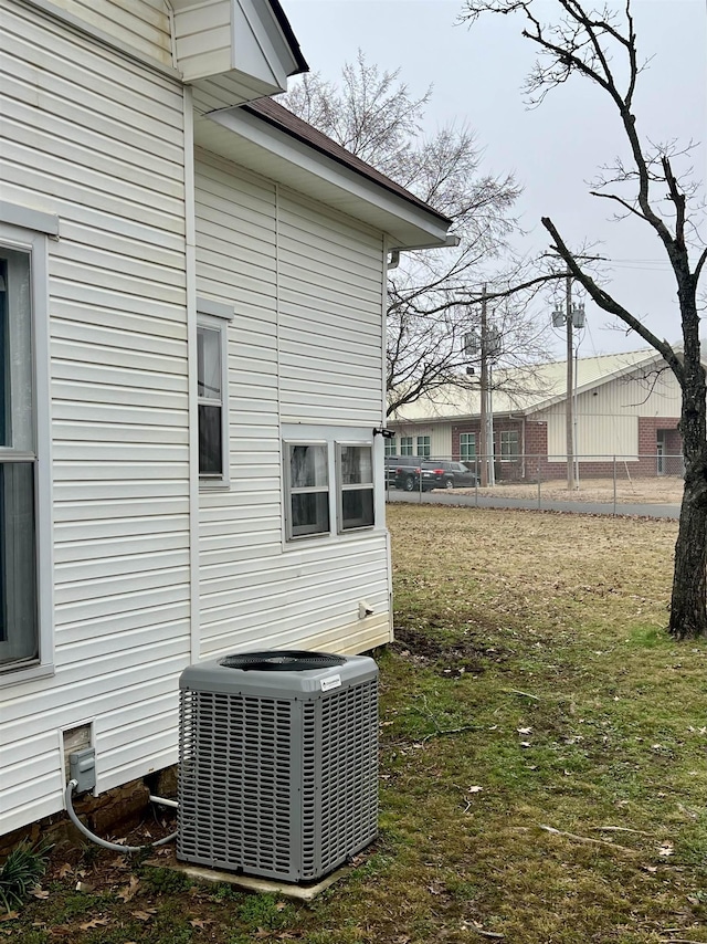 exterior details featuring a yard and central air condition unit