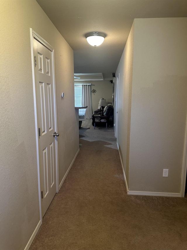 hallway featuring light carpet