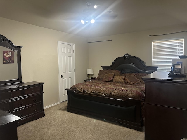 bedroom with light carpet