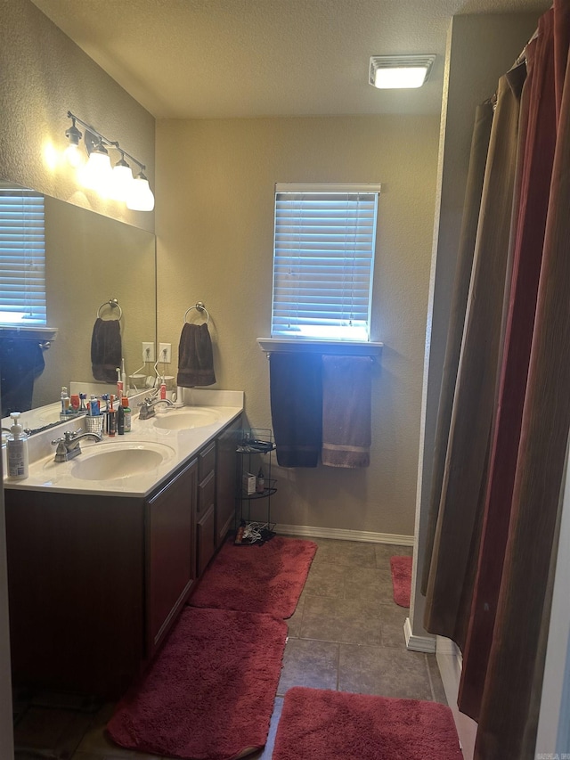 bathroom with vanity and tile patterned flooring