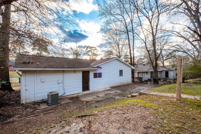 back of house featuring cooling unit and a patio area