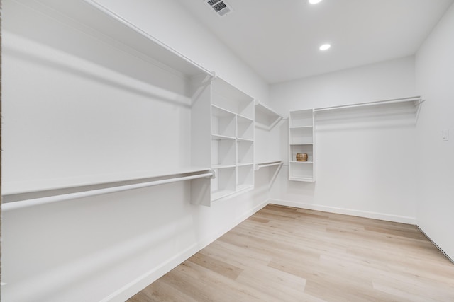 walk in closet featuring light hardwood / wood-style floors