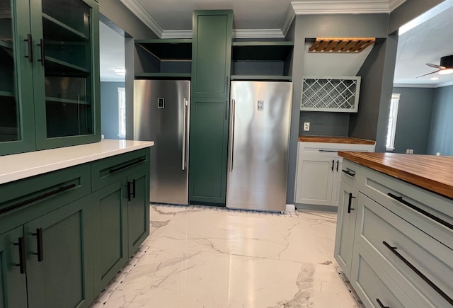 kitchen featuring butcher block countertops, stainless steel fridge, and ornamental molding