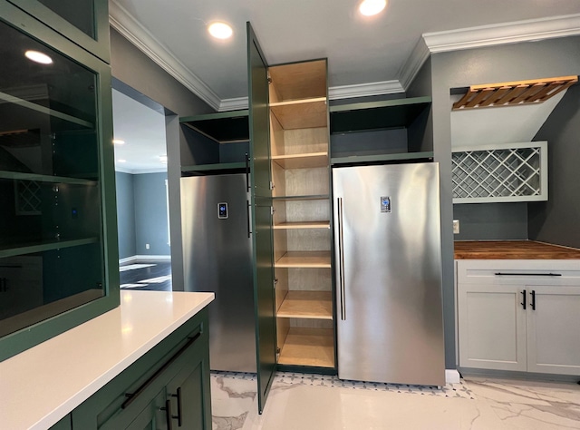 kitchen featuring butcher block counters, crown molding, stainless steel fridge, and green cabinets