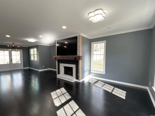 living room with ornamental molding, dark hardwood / wood-style flooring, and a fireplace