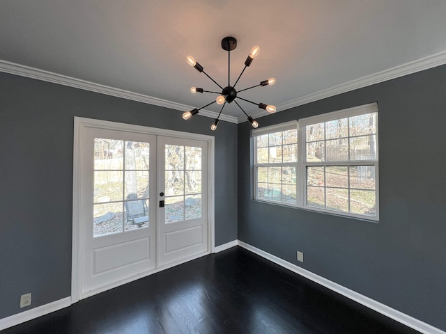 doorway featuring crown molding, dark hardwood / wood-style floors, and a notable chandelier