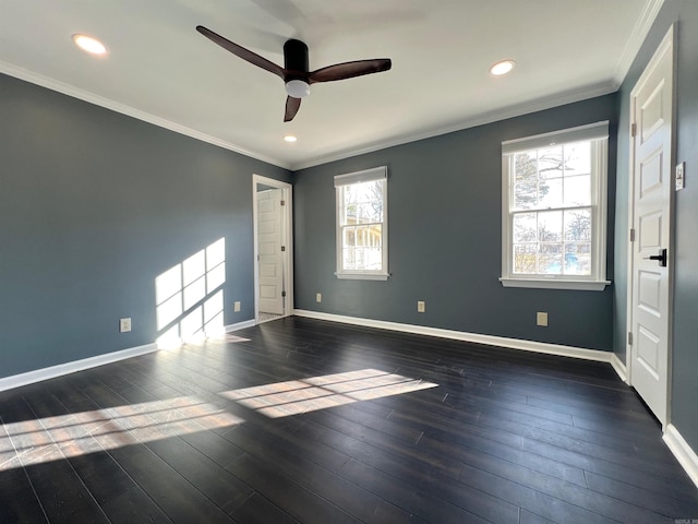 unfurnished room with crown molding, ceiling fan, and dark hardwood / wood-style floors