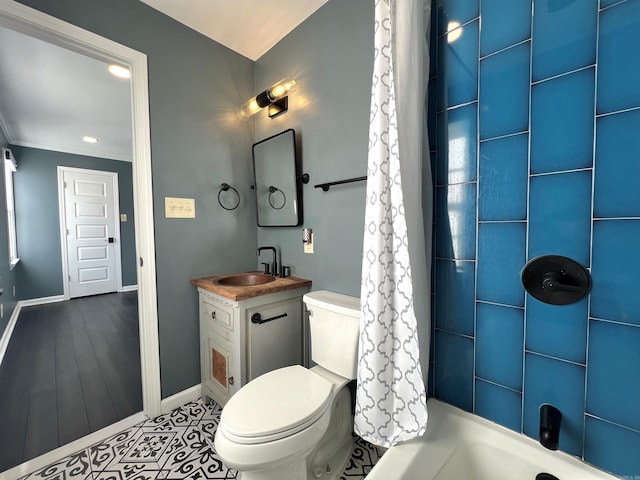 full bathroom featuring vanity, shower / tub combo, and toilet